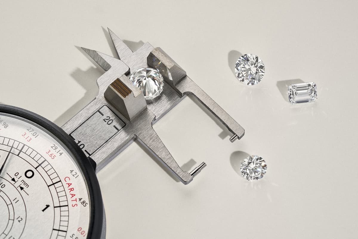 Hand wearing a round brilliant cut diamond ring