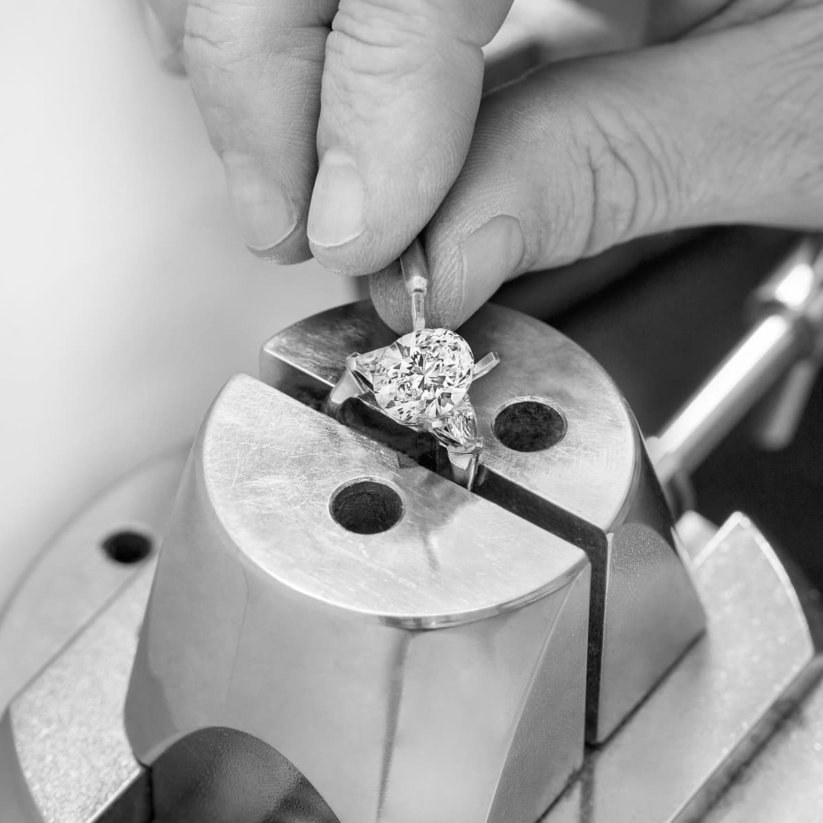 Hand wearing a round brilliant cut diamond ring