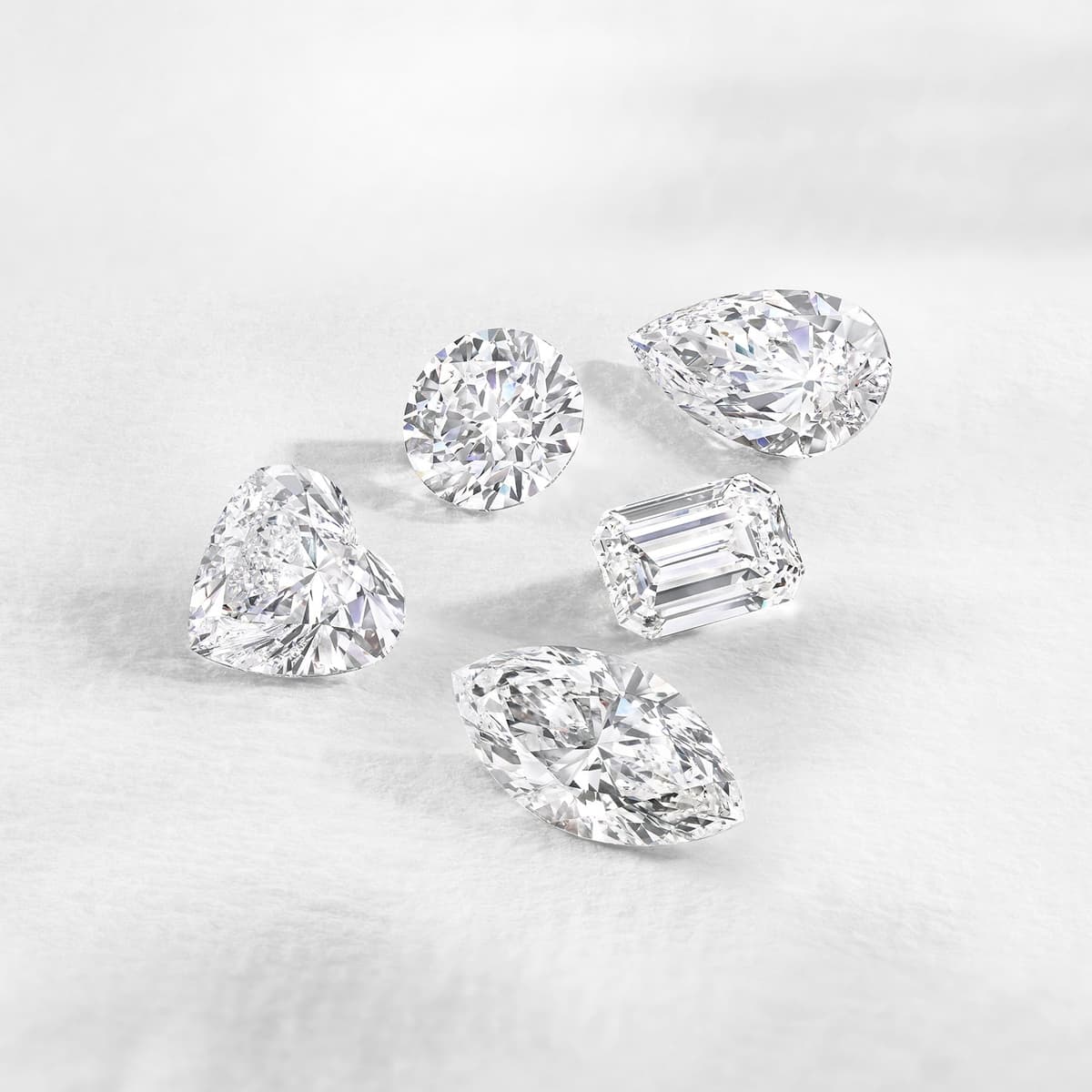 Hand wearing a round brilliant cut diamond ring